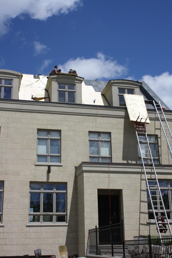 Initial stages of expert metal roof replacement, done by Davidoff Roofing.
