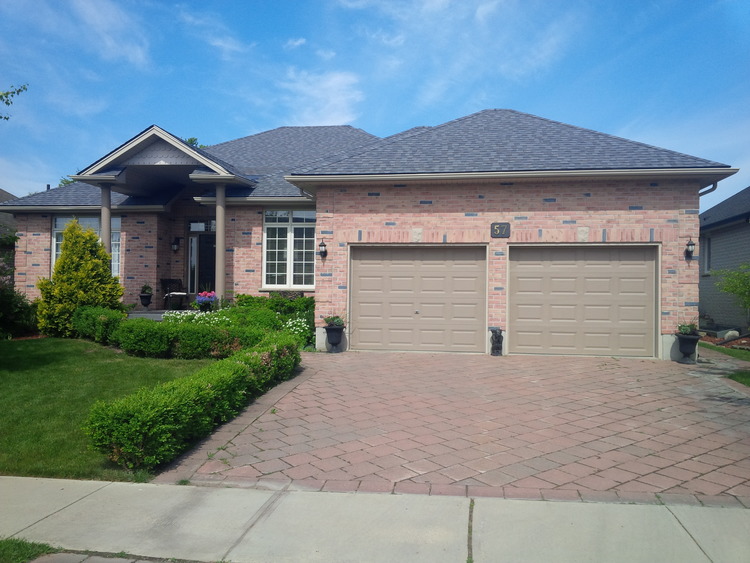 Brick exterior of London Ontario home after exterior home renovation from Davidoff Roofing  