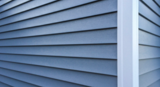 Close up of blue vinyl siding.