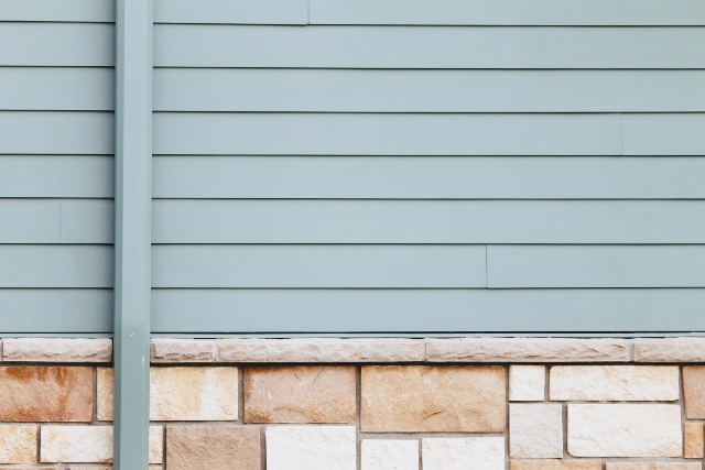 Close up of blue siding on a home
