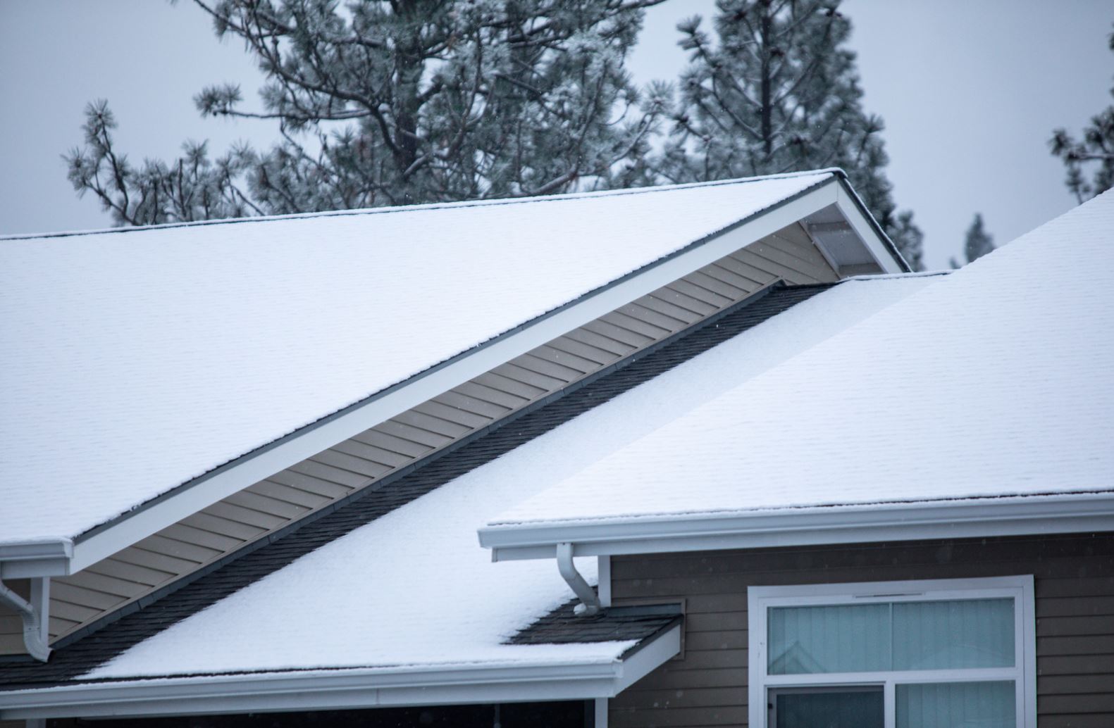 Snow and ice sitting on a residential roof in London, Ontario