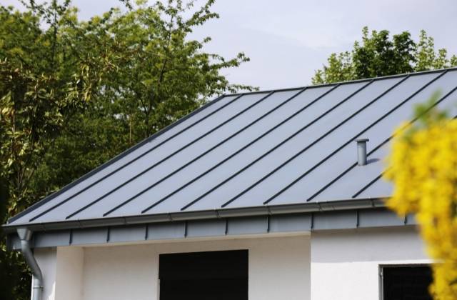 Metal standing seam roof on a residential home.