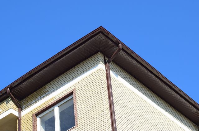 A well-maintained eavestrough on a house.