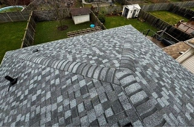 Asphalt Shingles in different shades of grey installed for a London, Ontario home.