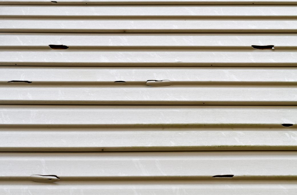 Signs of Damage to House Siding After a Storm