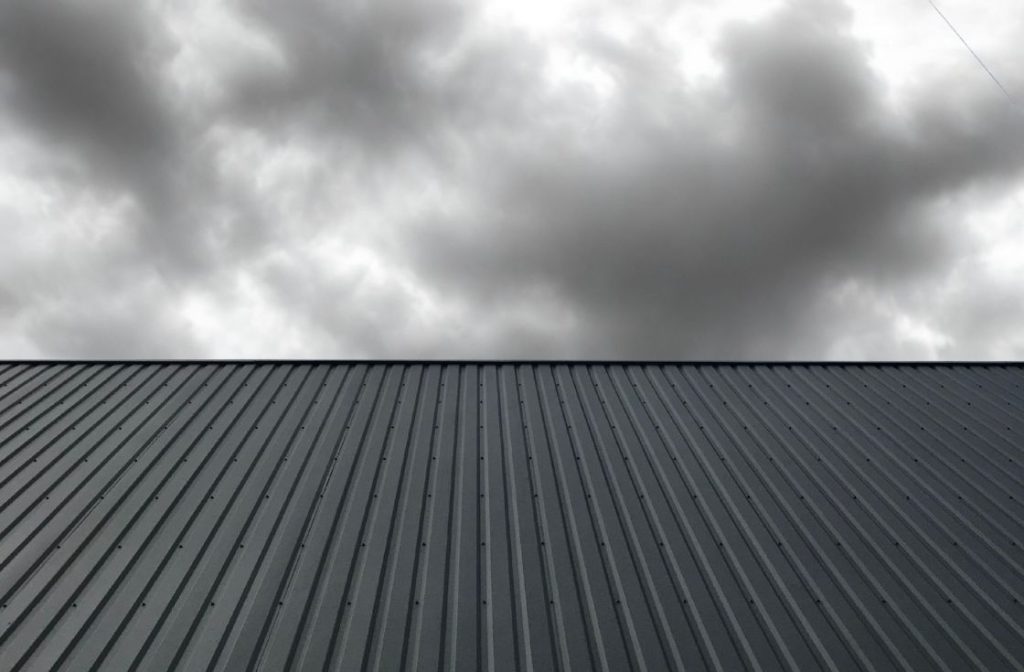 Commercial roof in Ontario being inspected after storm damage